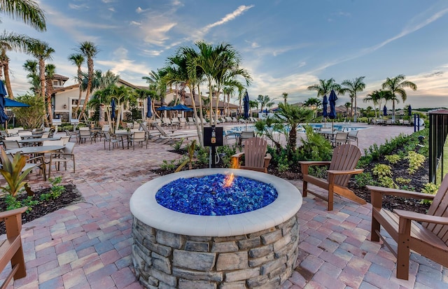 patio terrace at dusk with a fire pit