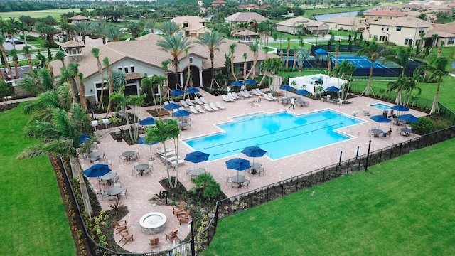 view of swimming pool with a patio area and a lawn