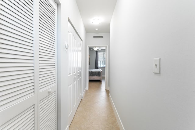 hallway with light tile patterned flooring