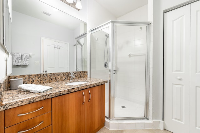 bathroom with vanity and an enclosed shower