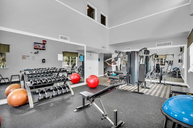 gym featuring a high ceiling