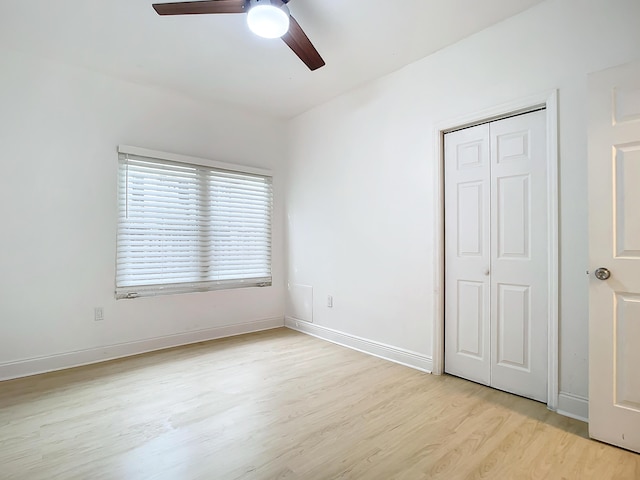 unfurnished bedroom featuring a closet, ceiling fan, and light hardwood / wood-style floors