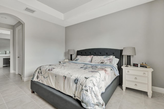 bedroom with light tile patterned floors