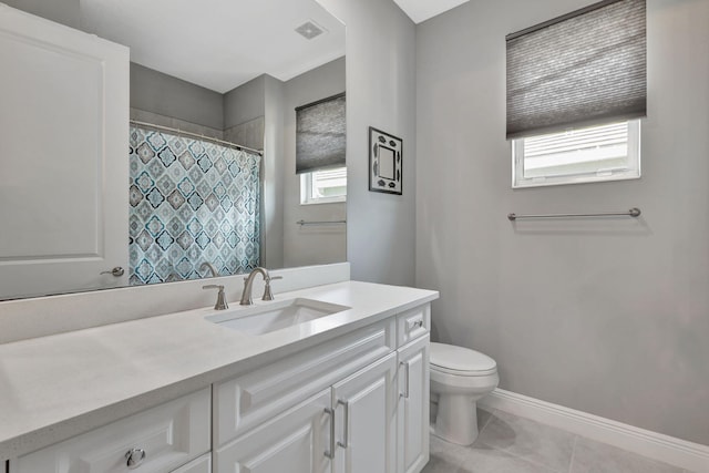 bathroom with toilet, vanity, tile patterned floors, and a shower with shower curtain