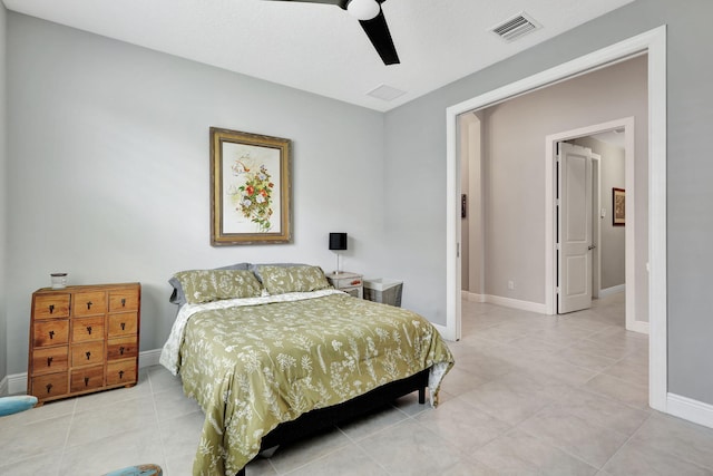 bedroom featuring ceiling fan and light tile patterned flooring