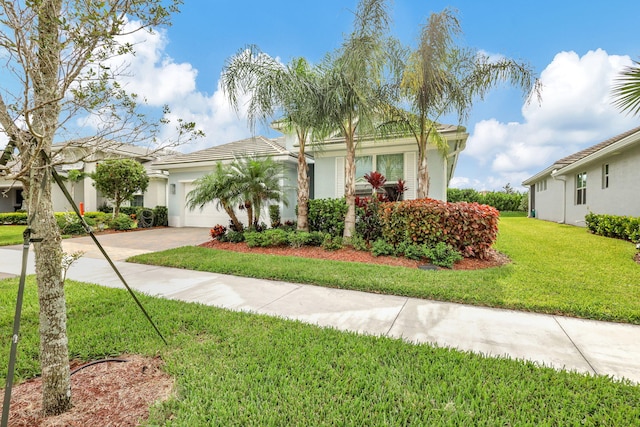 view of front facade with a front lawn and a garage