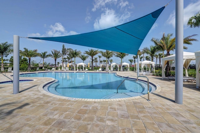 view of swimming pool featuring a gazebo and a patio area