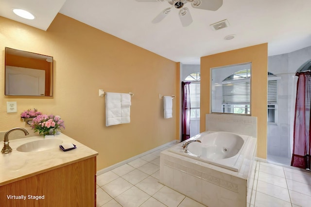 full bath with visible vents, vanity, a whirlpool tub, and tile patterned floors