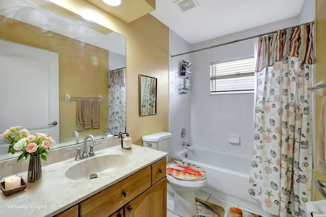 full bath featuring shower / tub combo with curtain, visible vents, toilet, vanity, and tile patterned floors