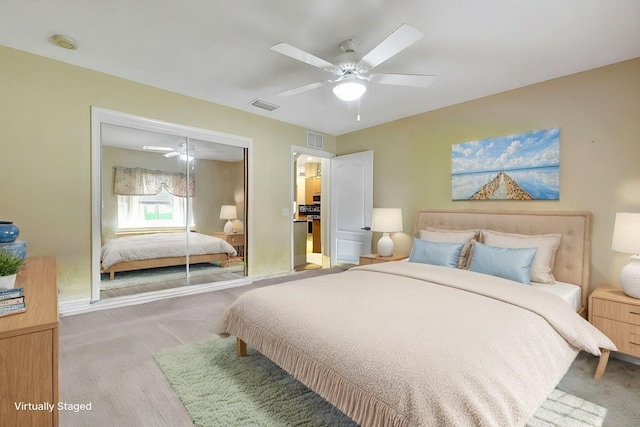 bedroom with ceiling fan, visible vents, a closet, and carpet flooring