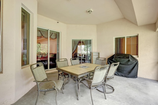 view of patio / terrace featuring outdoor dining space and a grill