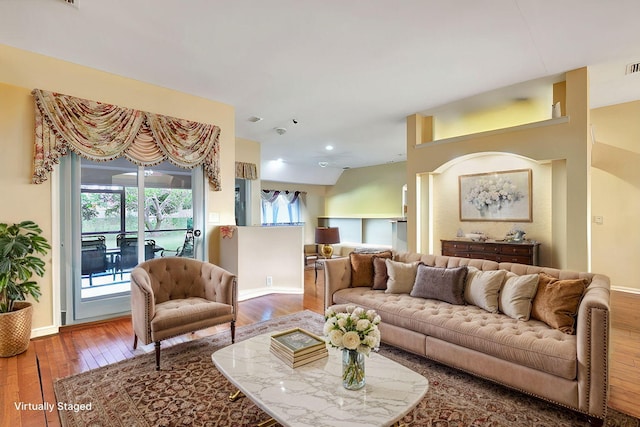 living area featuring recessed lighting, baseboards, visible vents, and hardwood / wood-style floors