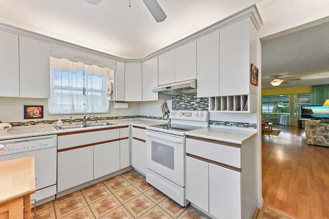 kitchen with sink, white appliances, white cabinetry, and ceiling fan