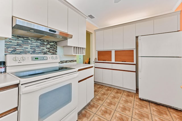 kitchen featuring decorative backsplash, white appliances, crown molding, and white cabinets