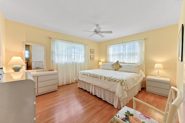 bedroom with ceiling fan and wood-type flooring