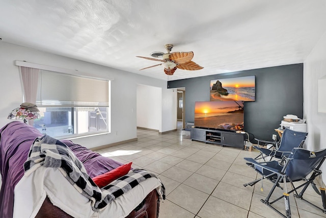 living room with ceiling fan and light tile patterned floors