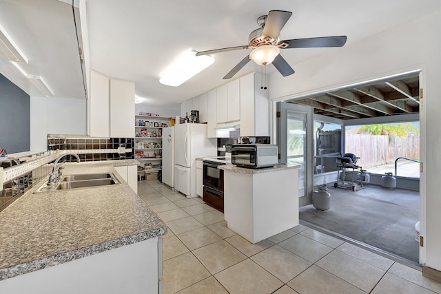 kitchen with white cabinetry, sink, ceiling fan, light tile patterned flooring, and black appliances