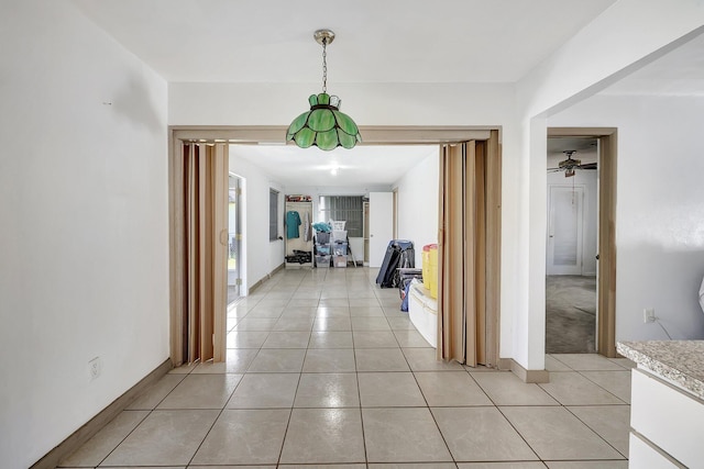 hallway featuring light tile patterned floors