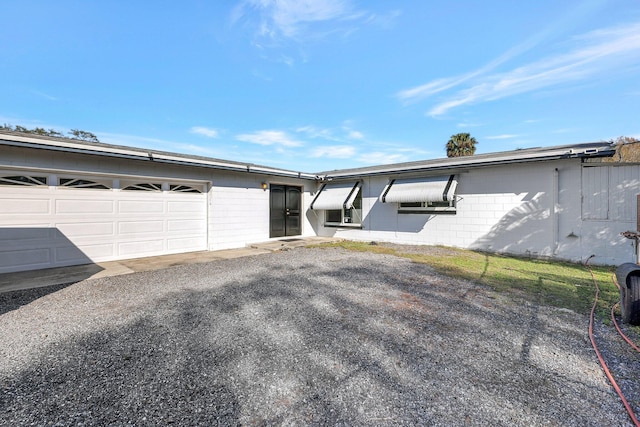 view of side of home featuring a garage