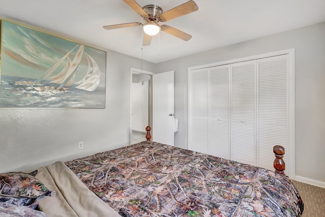 bedroom with carpet, a closet, and ceiling fan