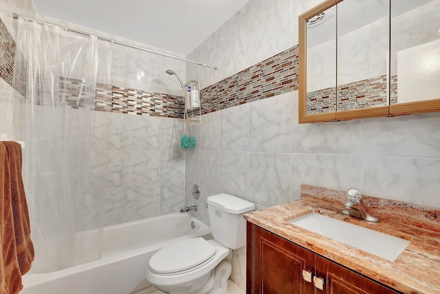 full bathroom featuring vanity, shower / bath combination with curtain, tile walls, and toilet