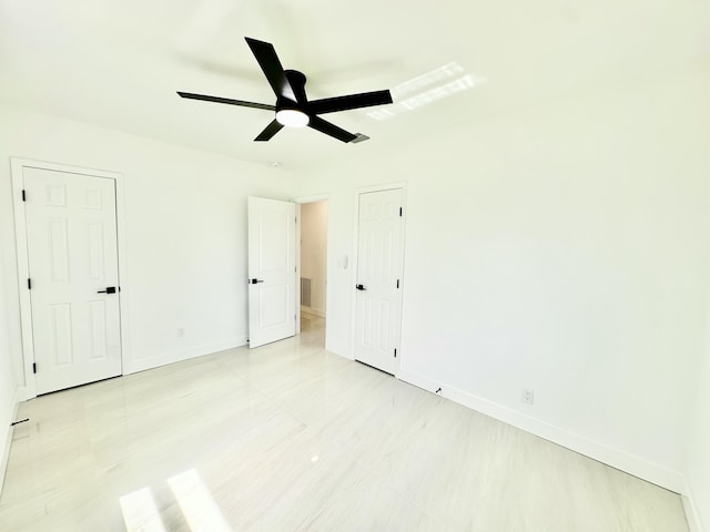 unfurnished bedroom featuring ceiling fan