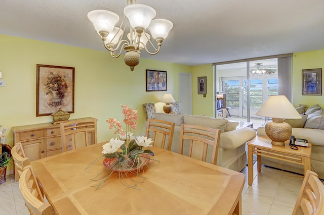 dining room featuring a chandelier, light tile patterned floors, a textured ceiling, and floor to ceiling windows