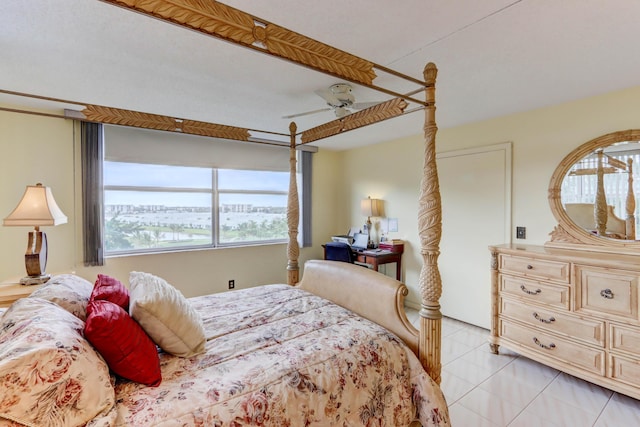 bedroom featuring ceiling fan and light tile patterned floors