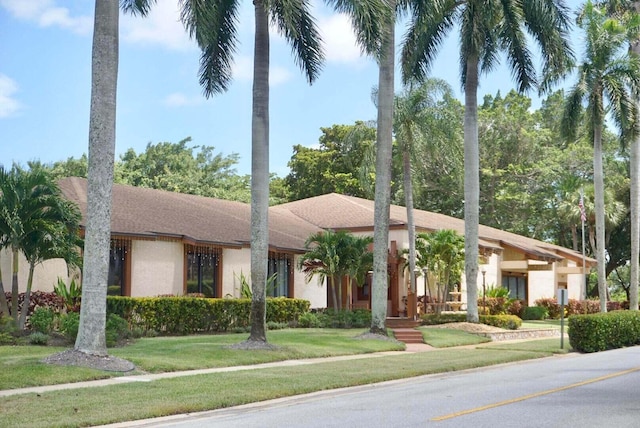 view of front of home with a front lawn