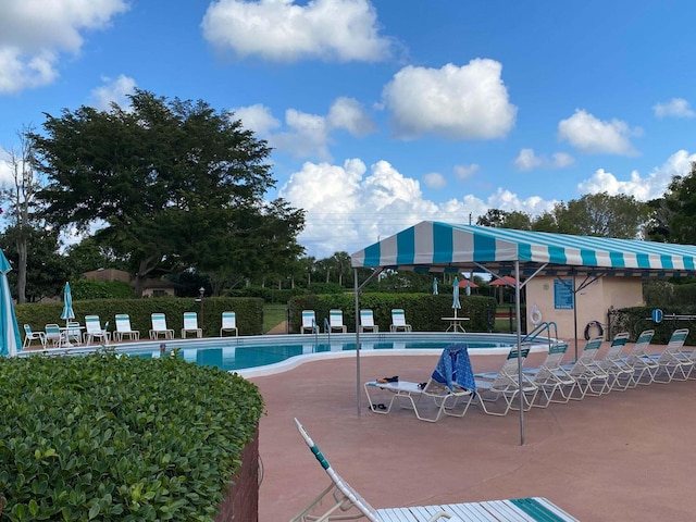 view of swimming pool featuring a patio area