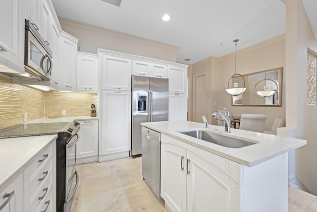 kitchen featuring sink, hanging light fixtures, stainless steel appliances, backsplash, and white cabinets