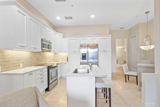 kitchen with white cabinets, appliances with stainless steel finishes, and sink