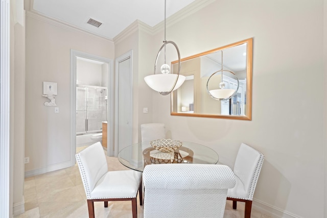 dining area featuring ornamental molding