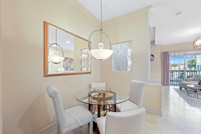 dining area with ornamental molding