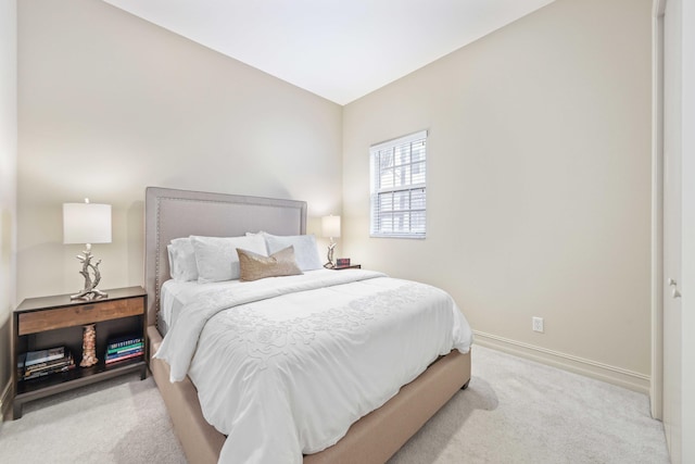 bedroom with light carpet