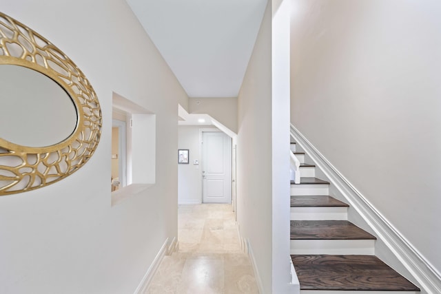 staircase featuring tile patterned floors