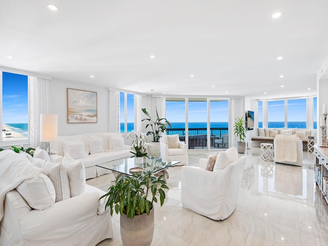 living room featuring a wall of windows