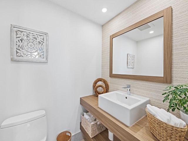 bathroom with sink and toilet