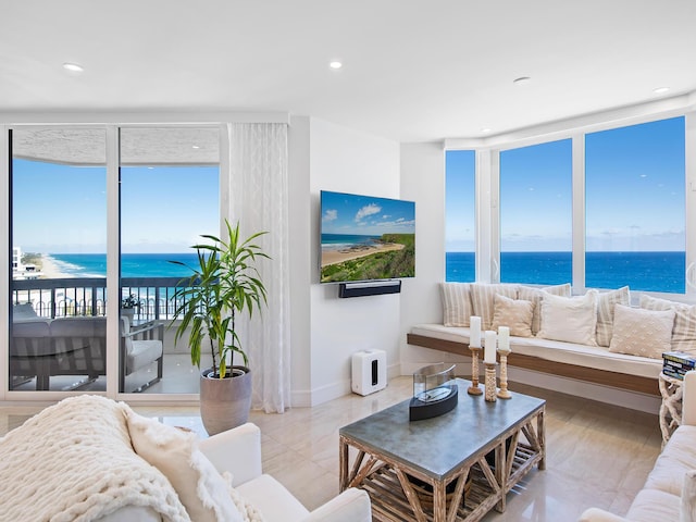 living room featuring a wall of windows