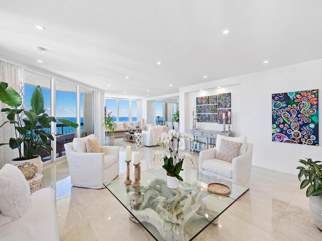 living room with light tile patterned flooring and expansive windows