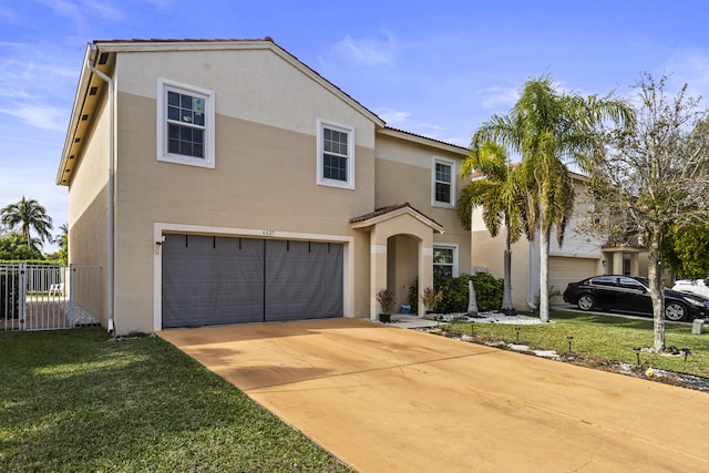 mediterranean / spanish-style house with a front lawn and a garage