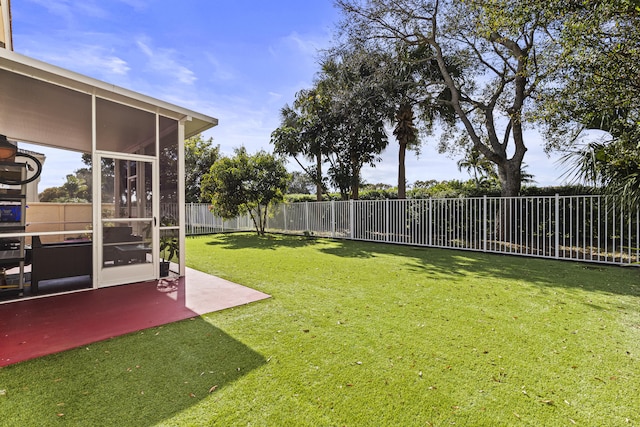 view of yard with a patio area and a sunroom