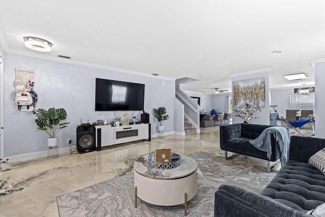 living room featuring ceiling fan and crown molding