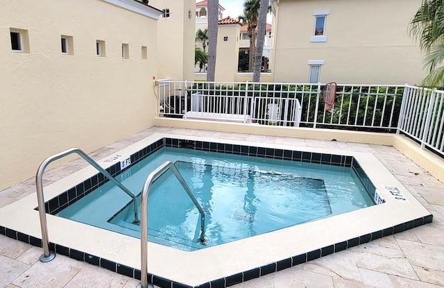 view of pool with a community hot tub