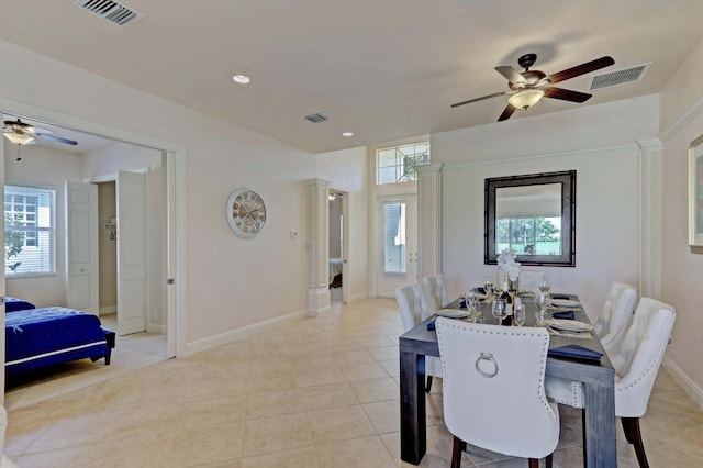 tiled dining space featuring ceiling fan and a healthy amount of sunlight