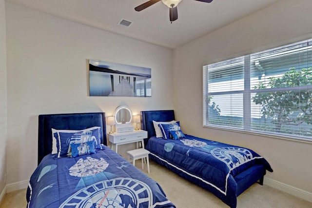 carpeted bedroom with ceiling fan