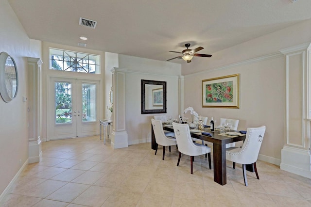 tiled dining space featuring ceiling fan and french doors