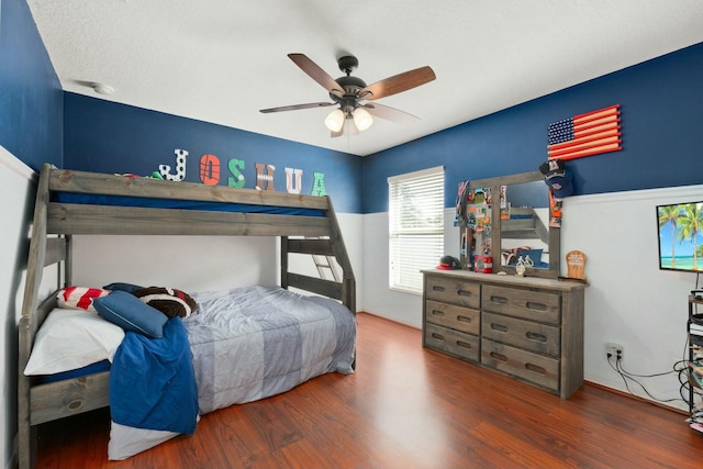 bedroom featuring dark wood-type flooring and ceiling fan