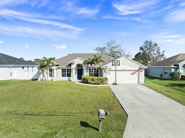 ranch-style house featuring a garage and a front lawn