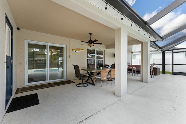 view of patio / terrace featuring a lanai and ceiling fan